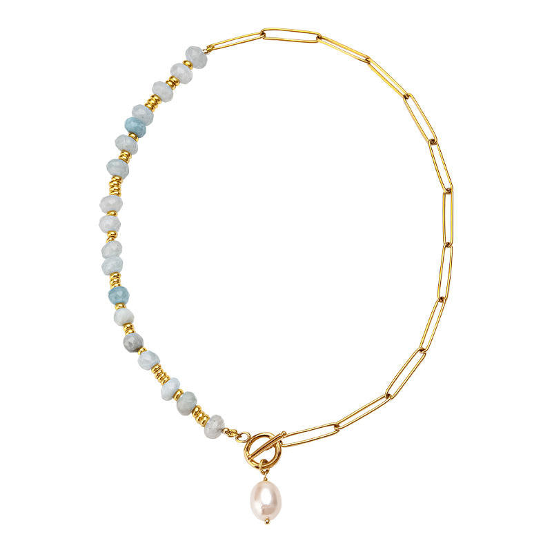 Zoé – Lunghi orecchini in oro con pendente di perla.