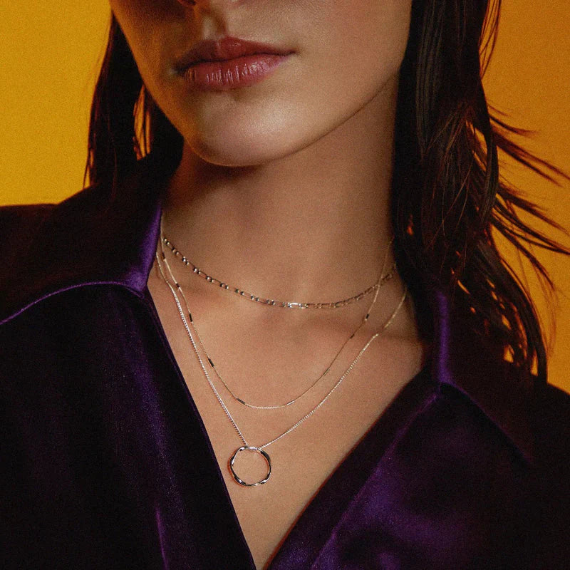 Collana aperta a tre fili