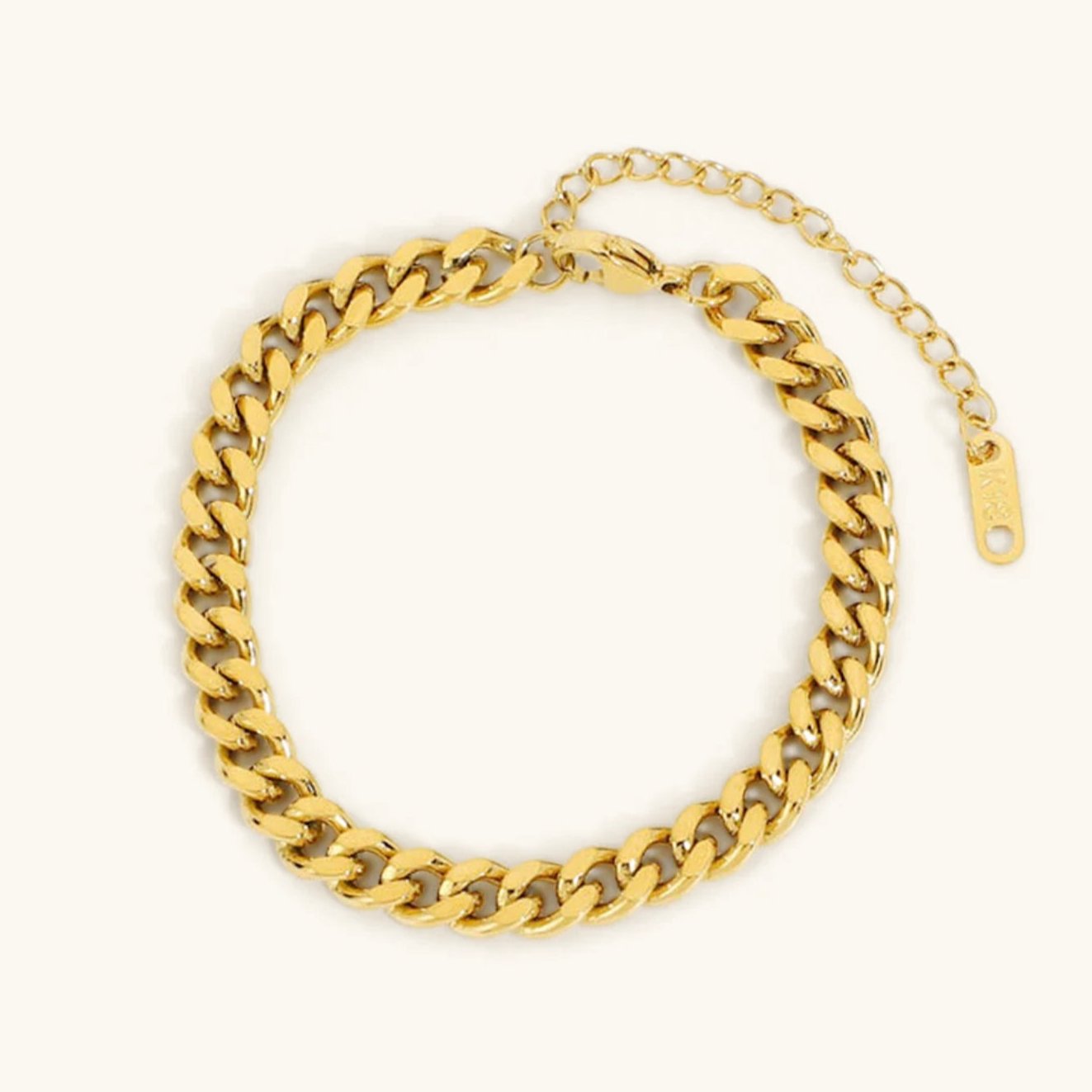 Sofia – Un delicato bracciale in oro con un delicato pendente.