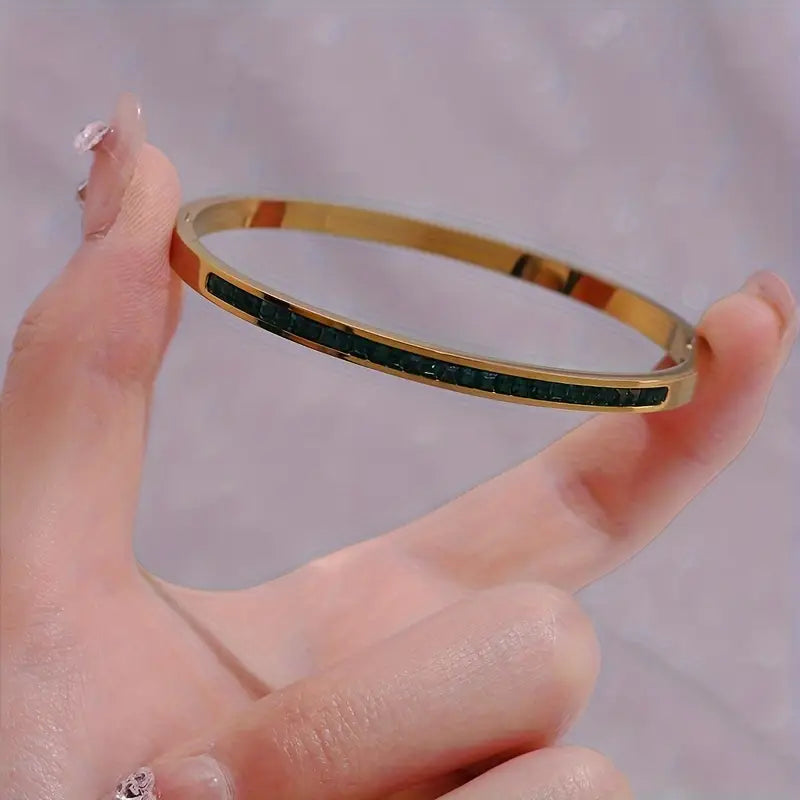 Leonora – Bracciale placcato oro con smeraldi.
