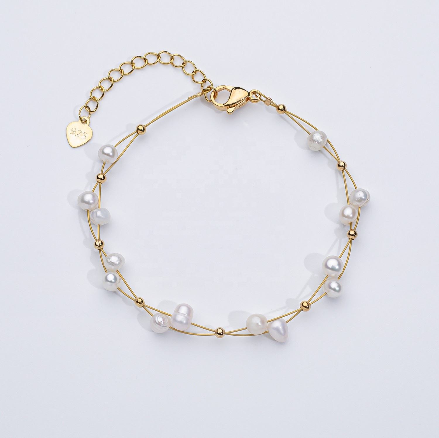 Marlena – Bracciale in oro con dettagli di perle.