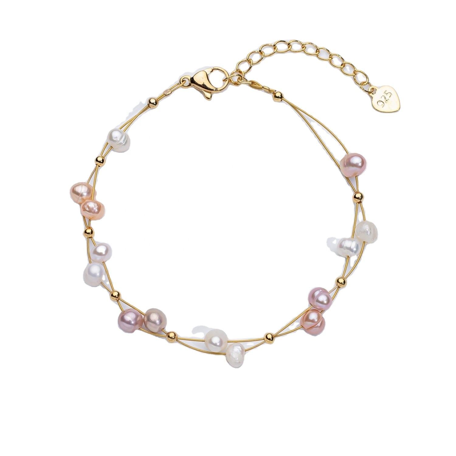 Marlena – Bracciale in oro con dettagli di perle.