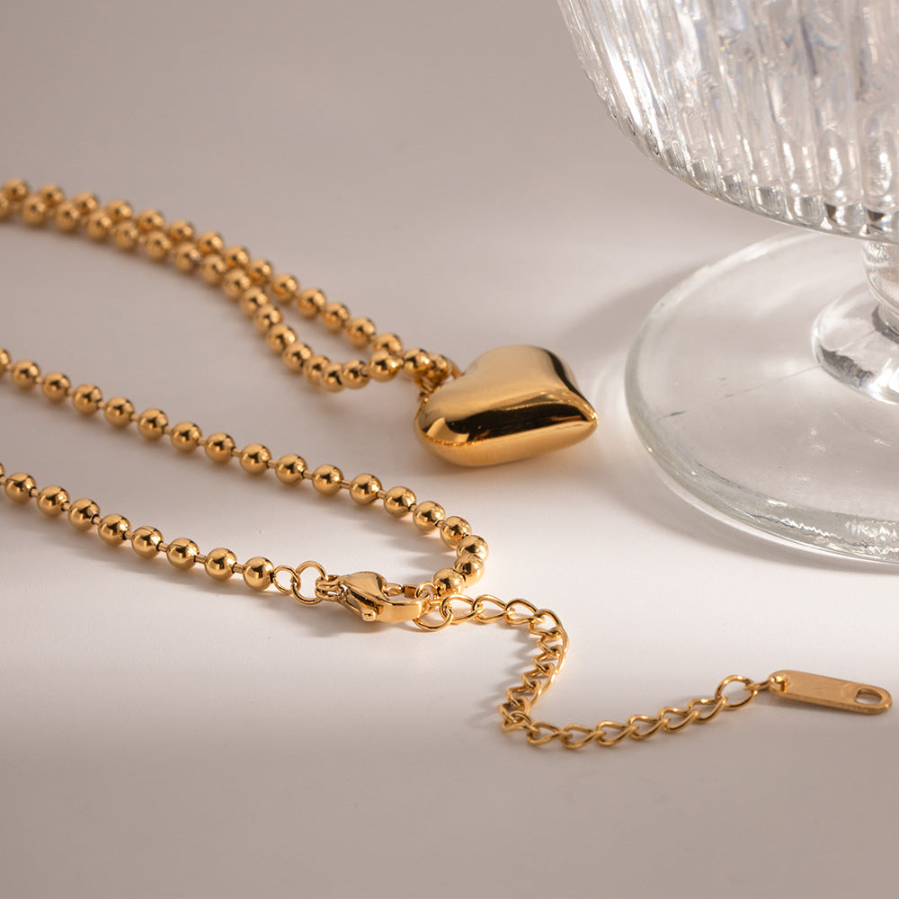 Amálie – Collana in oro con medaglione moderno.