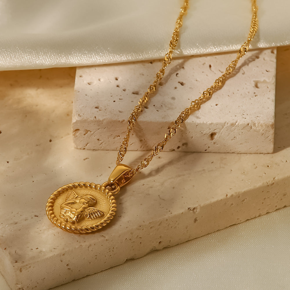 Elisabeth – Collana dorata con piccoli pendenti simbolici